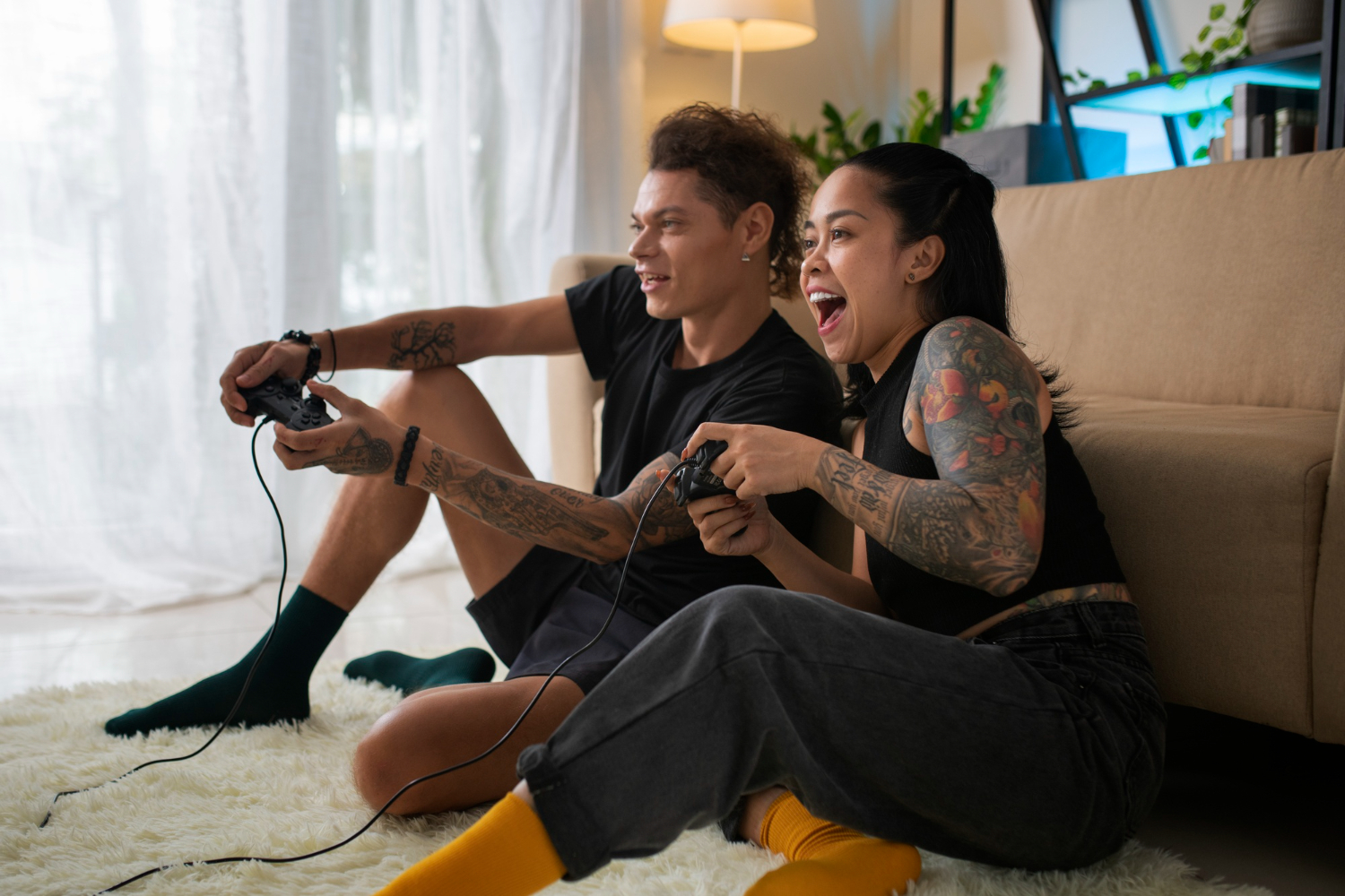 two man standing holding gaming controllers