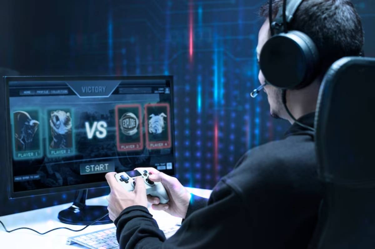 A gamer wearing a headset plays a video game, focused on a screen displaying a victory screen and player stats.