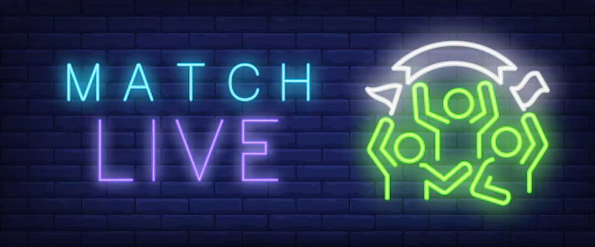 Neon sign reading MATCH LIVE with a graphic of cheering fans, symbolizing energy and excitement in sports events.