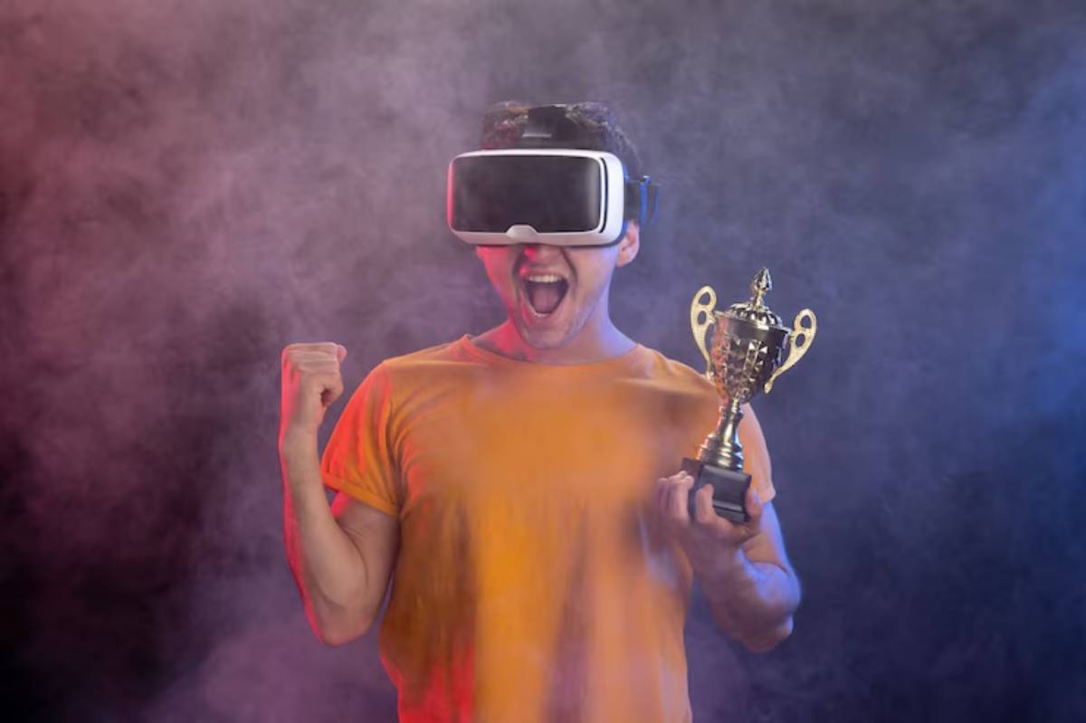 A person wearing a virtual reality headset poses triumphantly with a trophy, surrounded by colorful smoke in the background.